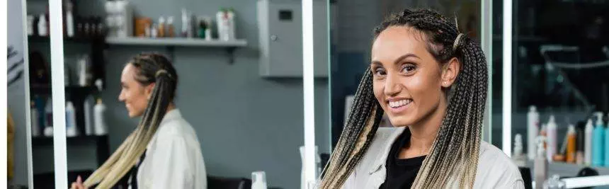 female client in hair salon,cheerful woman with braids